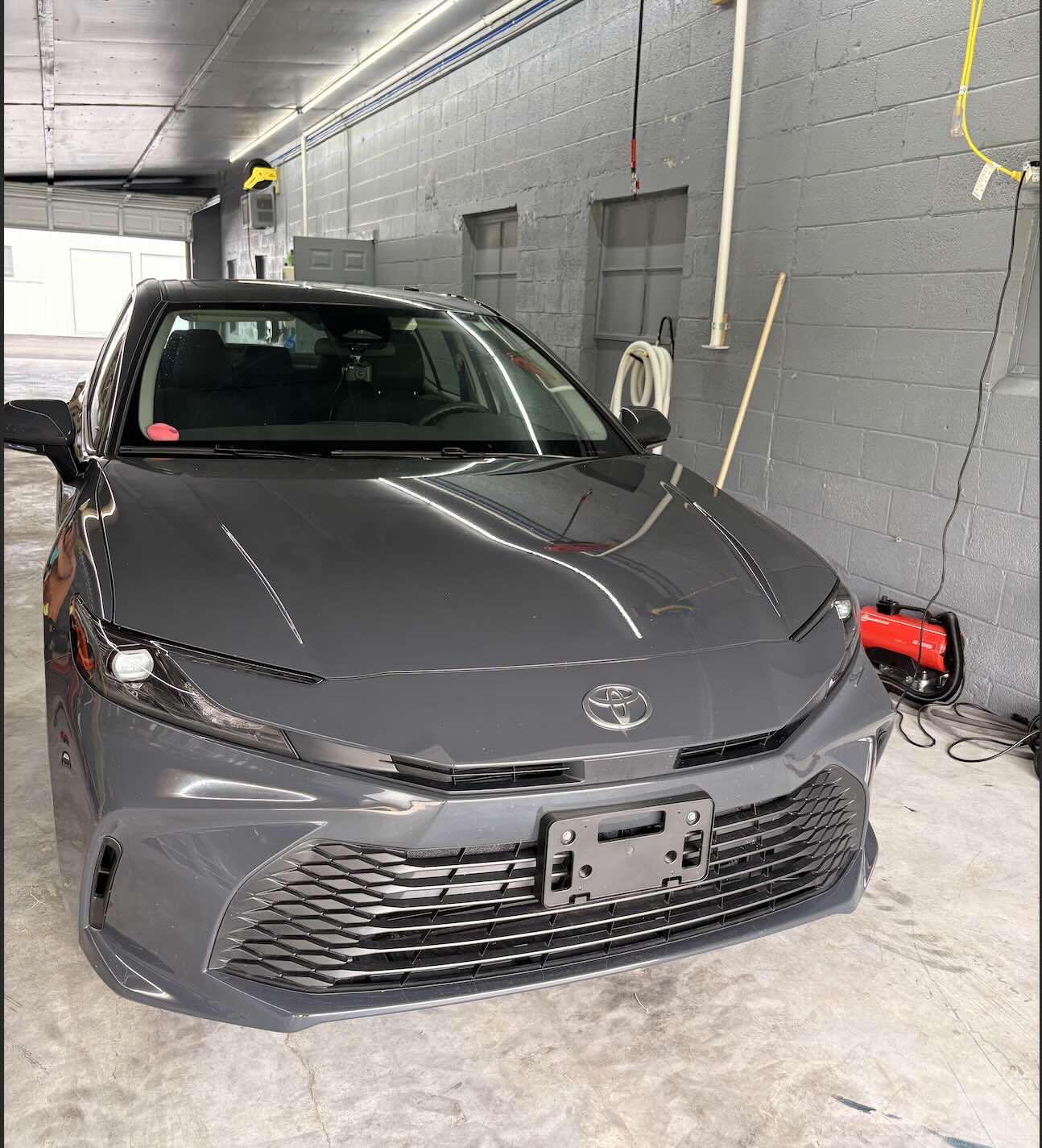 Grey Toyota Camry clean and finished in the bay