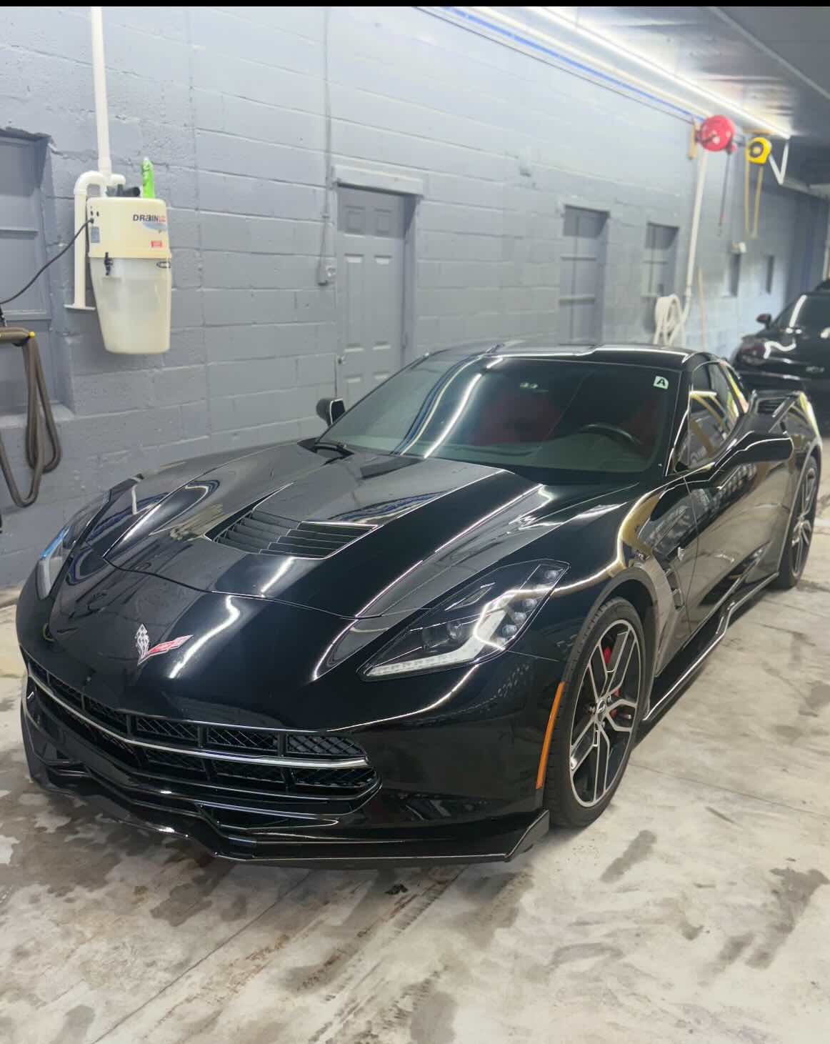 Finished black Corvette Stingray after detailing